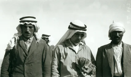 Garstang (holding chalice) and two members of the excavation team